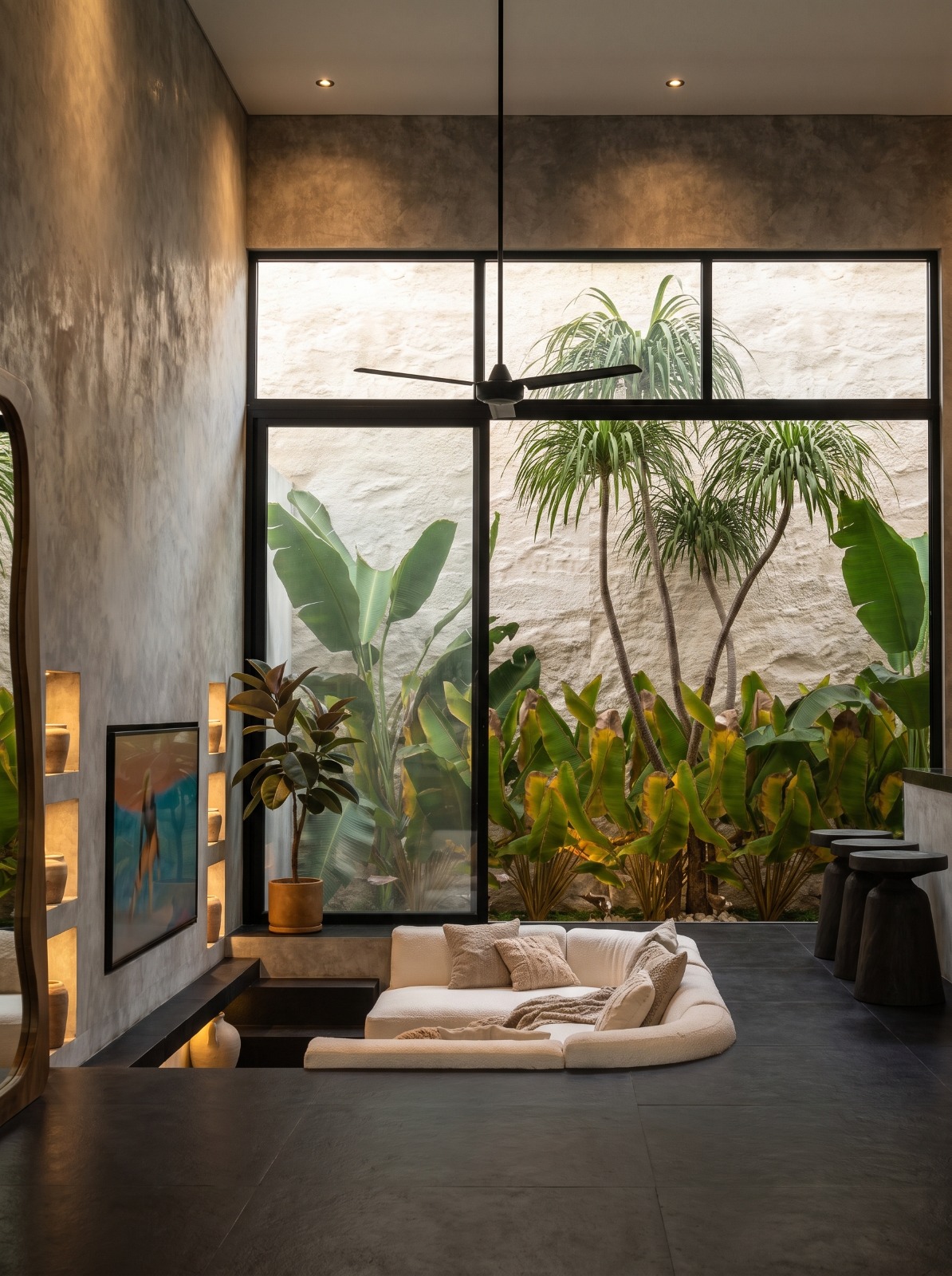 Sunken lounge opening onto the planted limestone courtyard