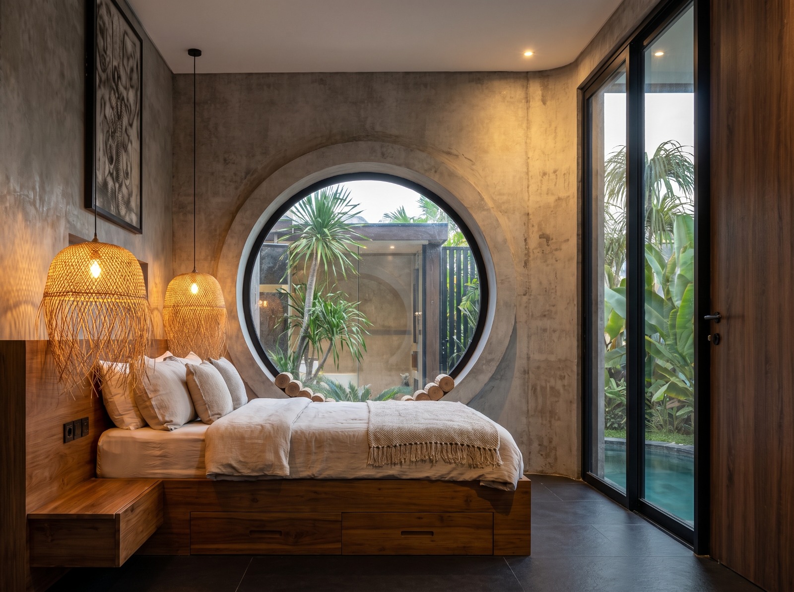 Guest bedroom with circular oculus window and direct access to the pool